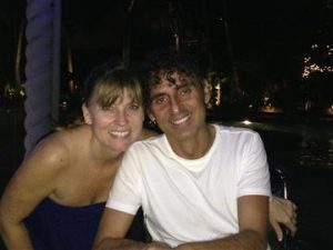 Man and woman posing for photo