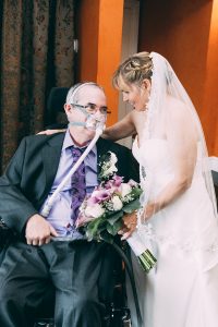 Man living with ALS and bride on their wedding day