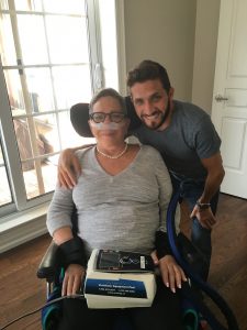 Jonathan Corber hugging mother, Wendy in her wheelchair